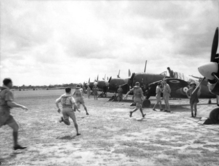 Pilots of No. 453 Squadron RAAF run to their Brewster Buffalo aircraft in response to a scramble order.