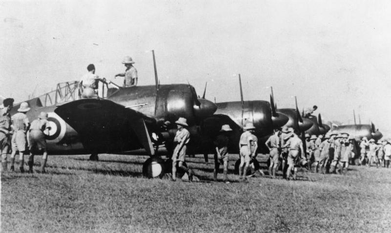 Brewster Buffalo Mark Is for the re-equipment of Nos. 21 and 453 Squadrons RAAF, being inspected by RAF personnel at Sembawang, Singapore.