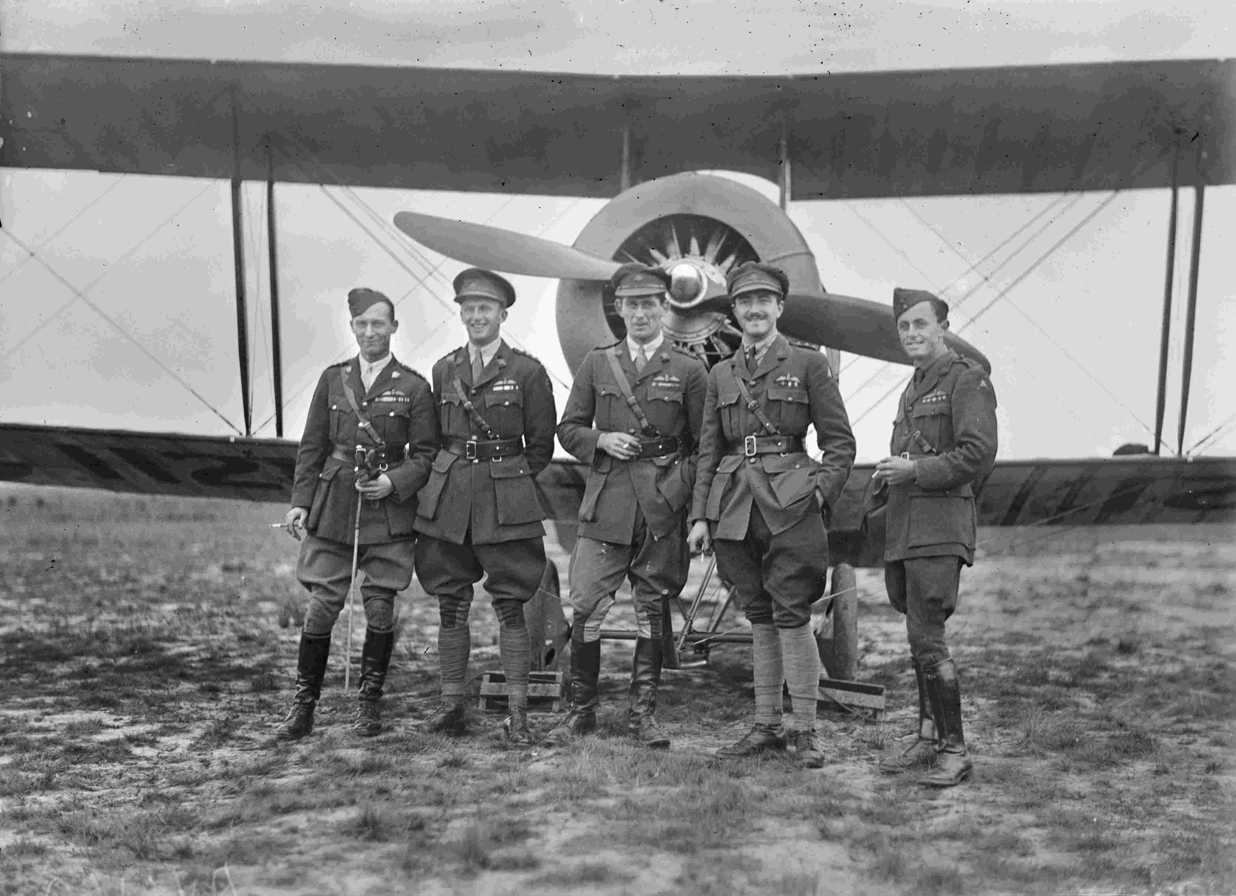 Avro 504 Group portrait of five decorated Australian Flying Corps officers standing in front of an Avro 504K aircraft, serial number is partially visible includes the numerals 112. AWM DAAV00160 via Brendan Cowan